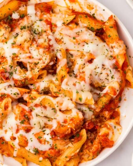 This chicken parmesan casserole combines everything you love about classic chicken parmesan, with a baked pasta dish. Perfect for a family dinner, this recipe uses store-bought shortcuts, and can also be made partially ahead of time or frozen!