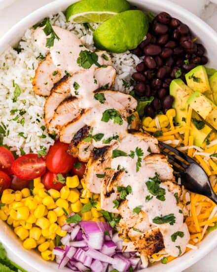 These chicken burrito bowls are a fun family dinner that can be made using a lot of leftovers, and parts of the recipe can be made ahead of time. This tex-mex recipe is also great for meal prep, and easy to customize to your tastes!