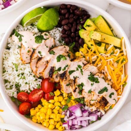 overhead photo of chicken burrito bowl in white bowl.