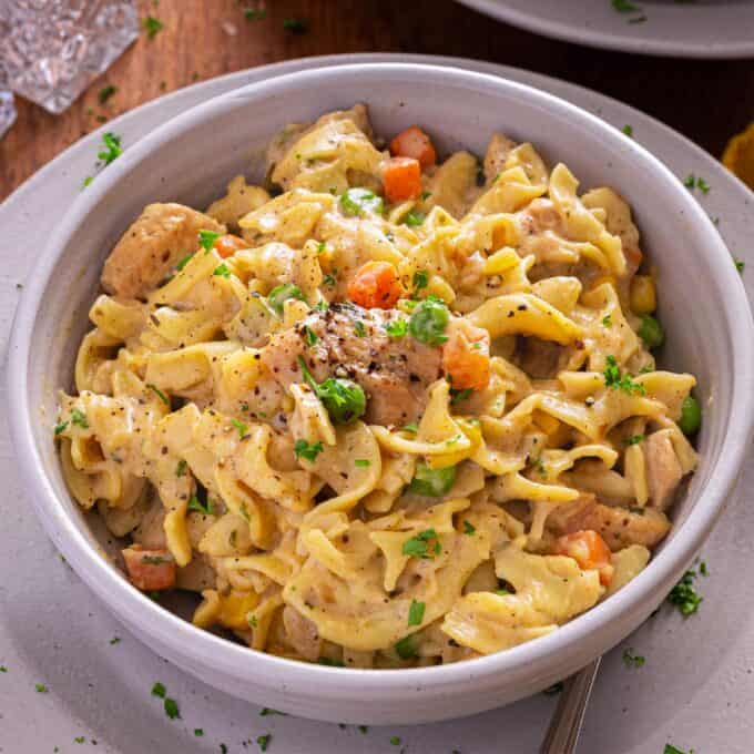 Bowl of chicken pot pie pasta on a plate.