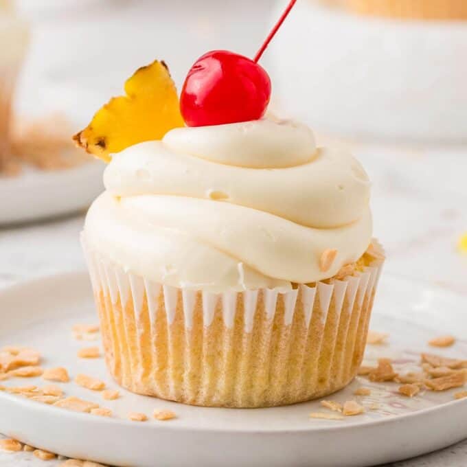 pina colada cupcake on a white plate