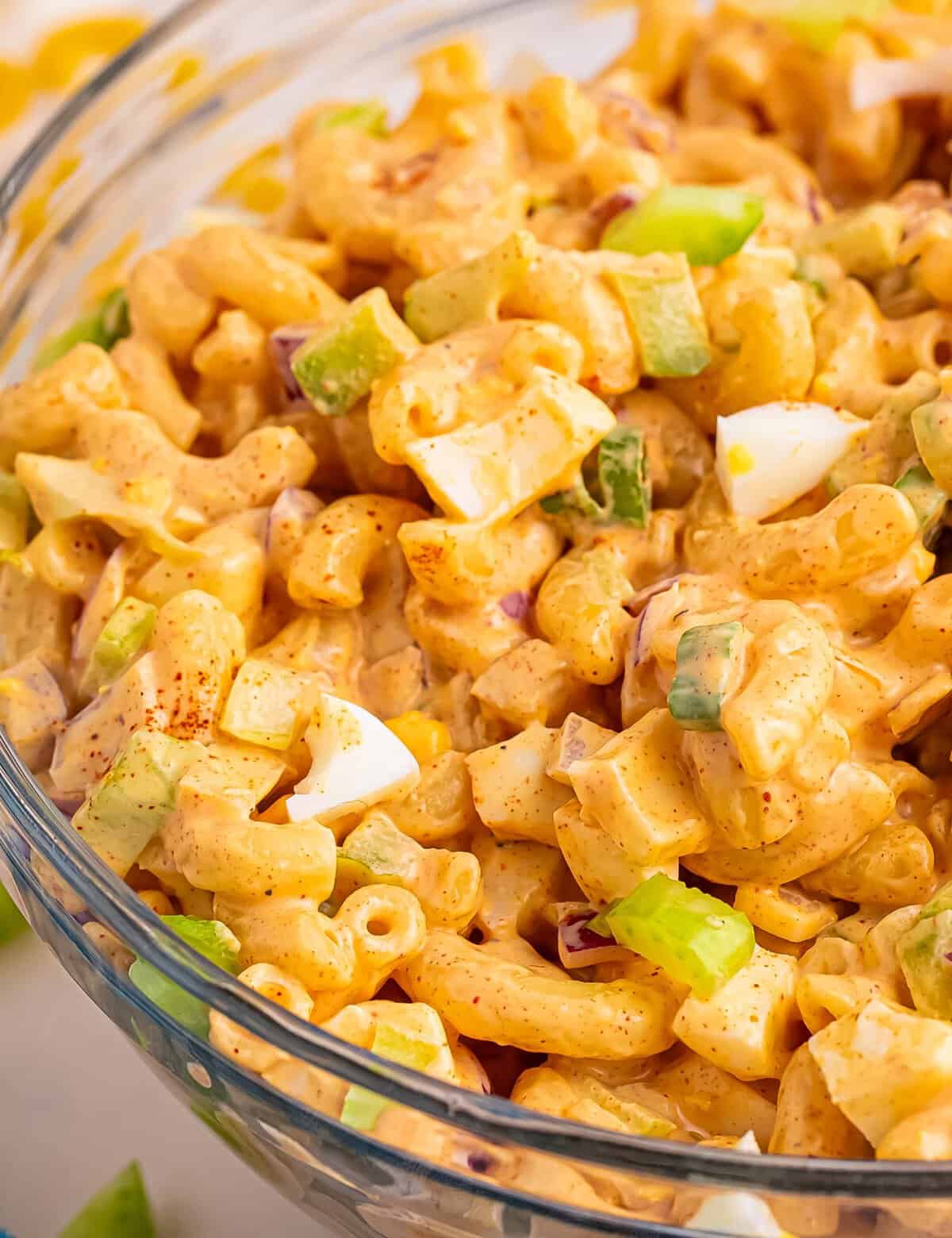 Everything you love about classic deviled eggs, combined with a creamy chilled macaroni salad! Perfect for summer cookouts and potlucks, and super easy to customize to your tastes.