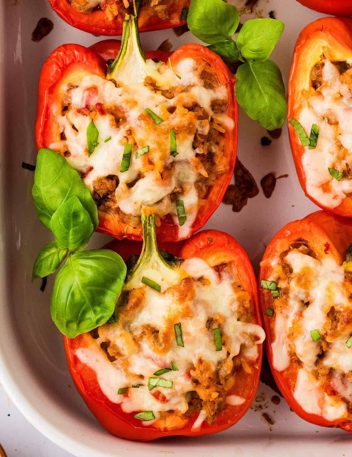 Stuffed peppers are a classic recipe for good reason; that they're incredibly delicious! This version combines fresh bell peppers, Italian sausage, tomatoes, spices, rice, and plenty of other flavors, to make a hearty dinner that's easy enough for every day, yet yummy enough to serve to company.