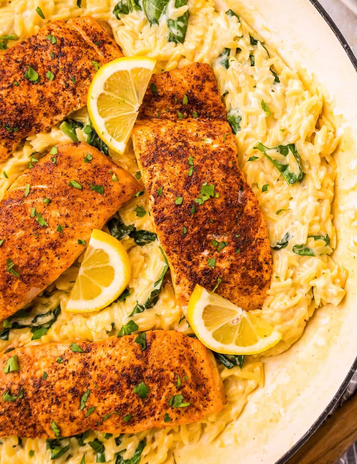 Juicy salmon seared in a pan, paired with a creamy spinach and parmesan orzo pasta, and all cooked in the same skillet! Perfect for a busy weeknight, yet fancy enough to serve to guests.