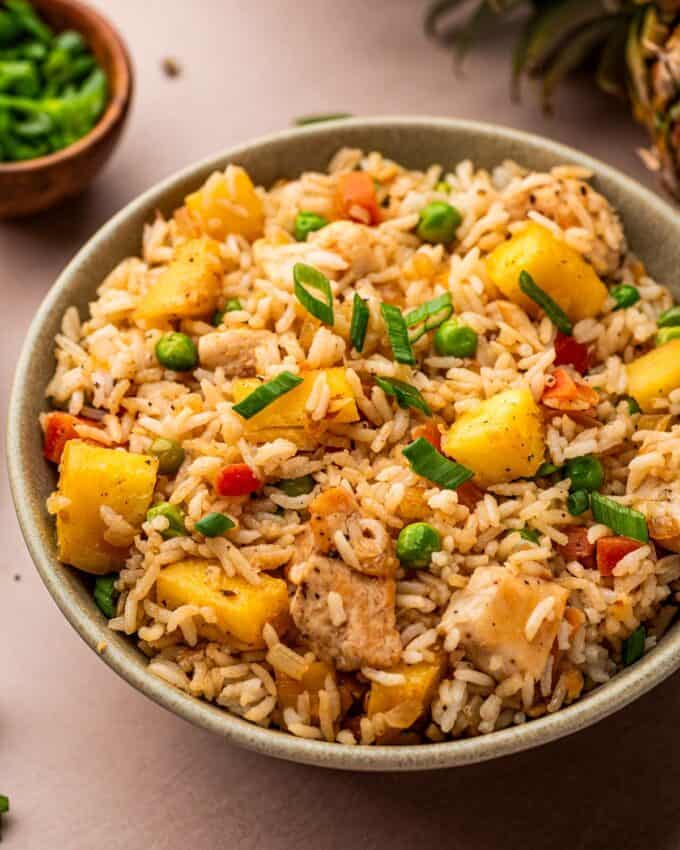 pineapple fried rice in cream colored bowl