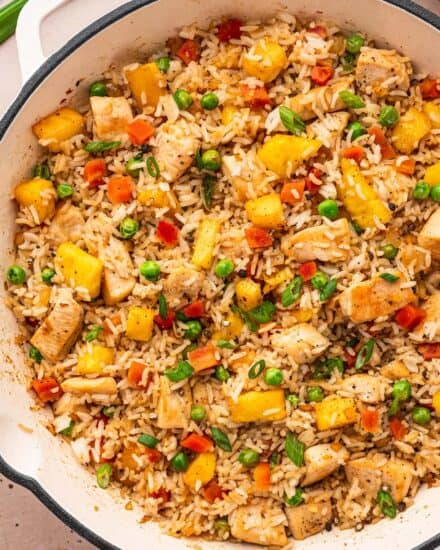 This takeout-style chicken and pineapple fried rice is packed with flavor, and on the table in 30 minutes or less! You'll love how easy this dinner recipe is to make and customize. It's great for meal prep as well!