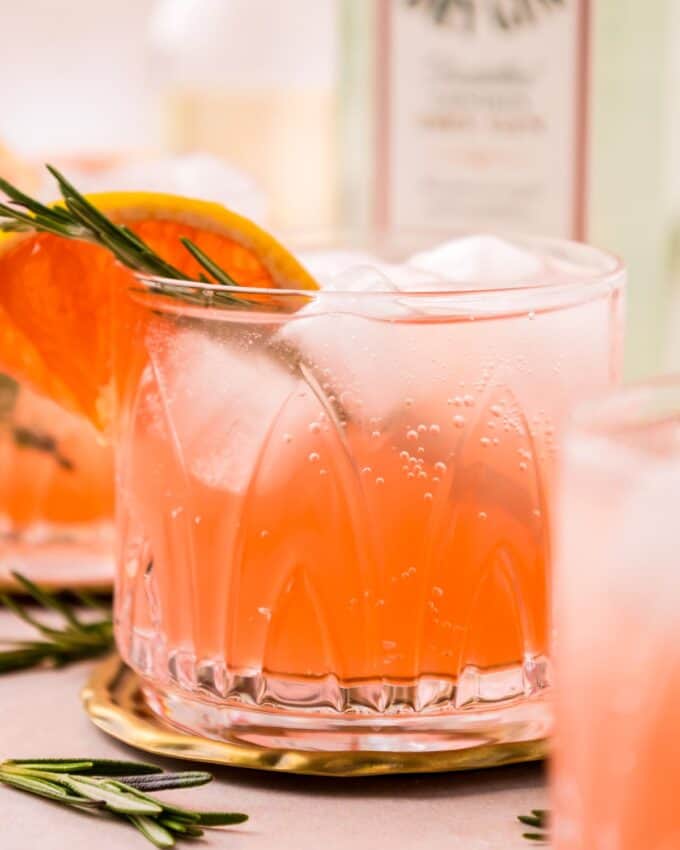 side view of the bubbles in a grapefruit gin fizz cocktail.