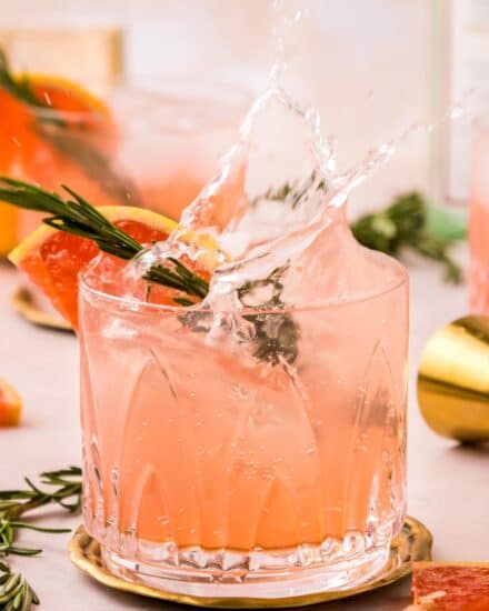 This gin fizz cocktail is sweet and tart, refreshingly crisp, and delicious! It's made with simple, every day ingredients, and is perfect for a hot summer day or a fun party!