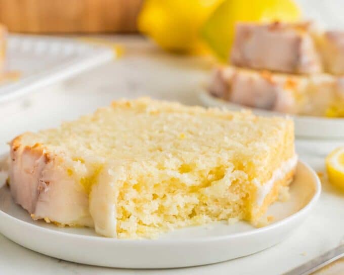 slice of lemon loaf with a bite taken out of it.