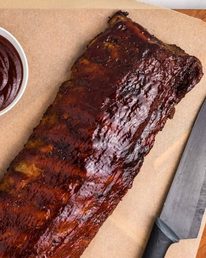 rack of bbq ribs on parchment paper
