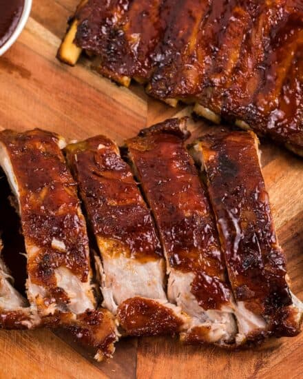Tender and sticky bbq ribs, cooked right in your oven! Perfect for when the weather is bad, or if you don't have a grill or smoker, but you still crave some fall off the bone deliciousness!