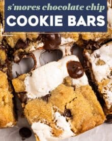 These s'mores chocolate chip cookie bars are chewy and soft, with a wonderfully ooey and gooey marshmallow layer in the middle, and crushed graham cracker crumbs in the cookie dough!