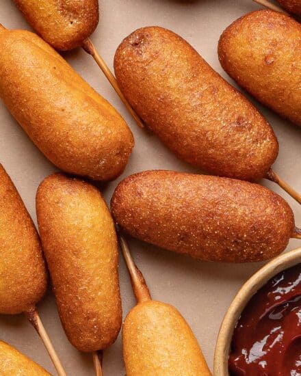 These homemade mini corn dogs are made with juicy hot dogs enveloped in a light and fluffy batter with a glorious touch of sweetness, that's fried until golden brown and crispy. Bring a taste of the fair home to your kitchen!