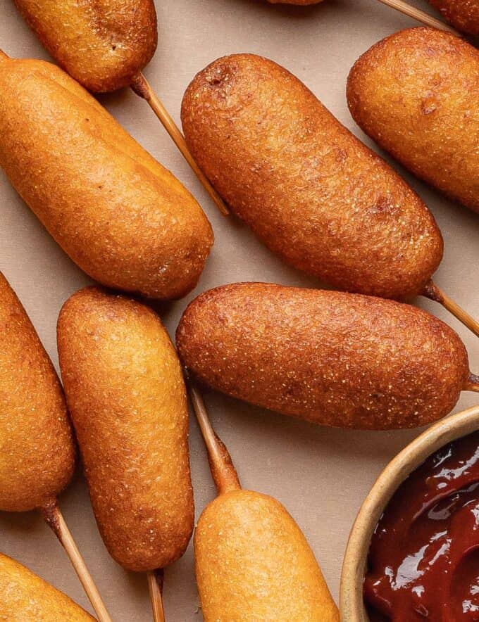These homemade mini corn dogs are made with juicy hot dogs enveloped in a light and fluffy batter with a glorious touch of sweetness, that's fried until golden brown and crispy. Bring a taste of the fair home to your kitchen!