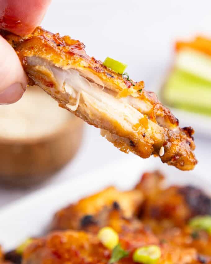 chicken wing with a bite taken out of it.