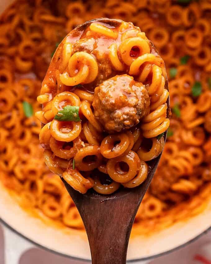 wooden serving spoon of spaghettios and meatballs