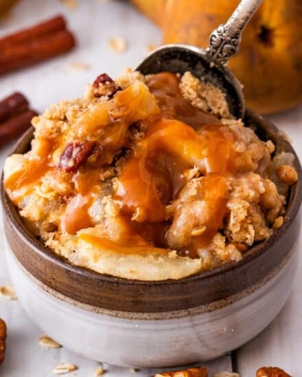 Take a bite out of Fall with this spiced pear crisp! This easy dessert is made the old-fashioned way like Grandma used to make, and is perfect with a scoop of vanilla ice cream and salted caramel sauce drizzled over the top!