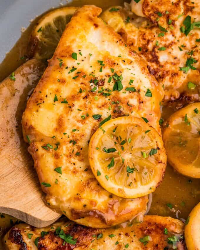 chicken francese topped with a charred lemon slice.
