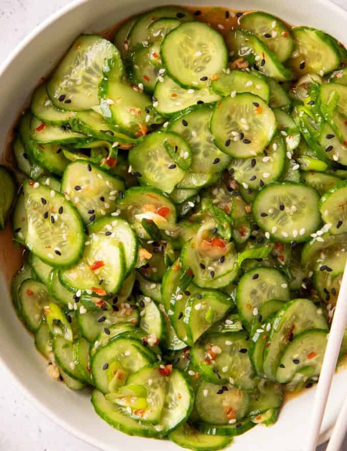 This asian cucumber salad is the perfect blend of crunchy, spicy, savory, a little sweet, and is oh-so refreshing! We love to have this alongside any takeout-style dinner, and it comes together quickly.