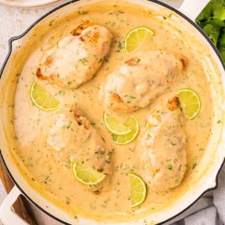 chicken breasts in a coconut lime sauce in a skillet