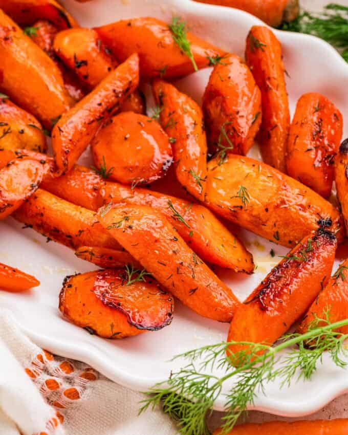 honey dill roasted carrots on a white scalloped platter