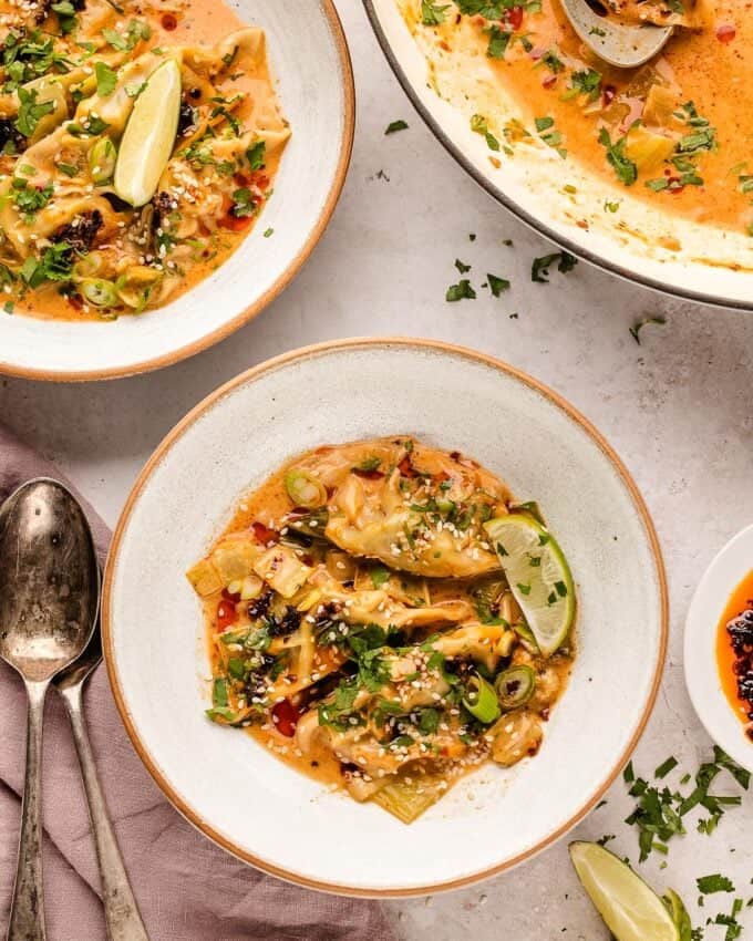 serving of red curry coconut dumplings in a white bowl