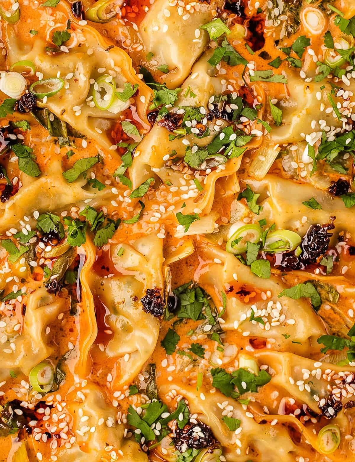 This dumpling bake went viral on TikTok and for good reason! Simple frozen dumplings are nestled into a silky and ultra-flavorful red coconut curry sauce, and it's all made (and assembled!) in just one pan. It's the perfect low-effort dinner that looks seriously impressive! #dumplings #easydinner #asianrecipe #viralrecipe