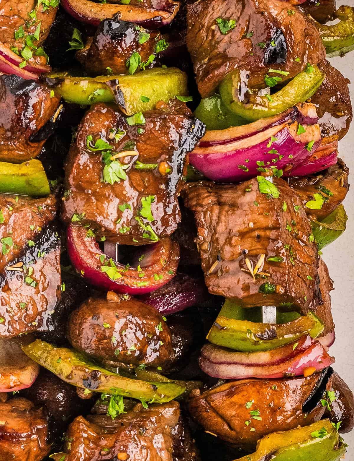 Tender steak bites and fresh mushrooms are marinated in an ultra-flavorful yet easy to make marinade, skewered with onions and peppers, then grilled to juicy steakhouse-style perfection!