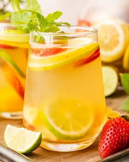 A crisp white sangria is the perfect chilled drink on a sweltering summer day! Easy to make and customize, this sangria recipe is so light and fruity, and sure to be a crowd-pleaser!