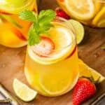 glasses of white sangria on a wooden board
