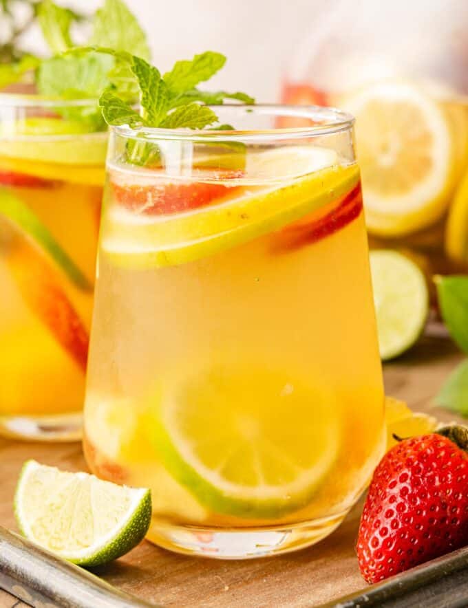 A crisp white sangria is the perfect chilled drink on a sweltering summer day! Easy to make and customize, this sangria recipe is so light and fruity, and sure to be a crowd-pleaser!