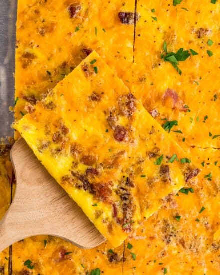 This egg scramble is perfect for a busy morning, meal prep, or holiday breakfast for a crowd! All the flavors of a meat-lovers scrambled eggs, but made on one sheet pan, so it's easy to slice and make sandwiches and more!